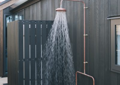 Outdoor copper shower with screen
